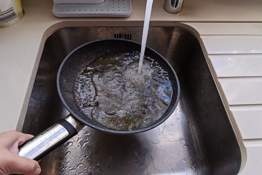 Plumbing Myth about running hot water down your drain to clear grease